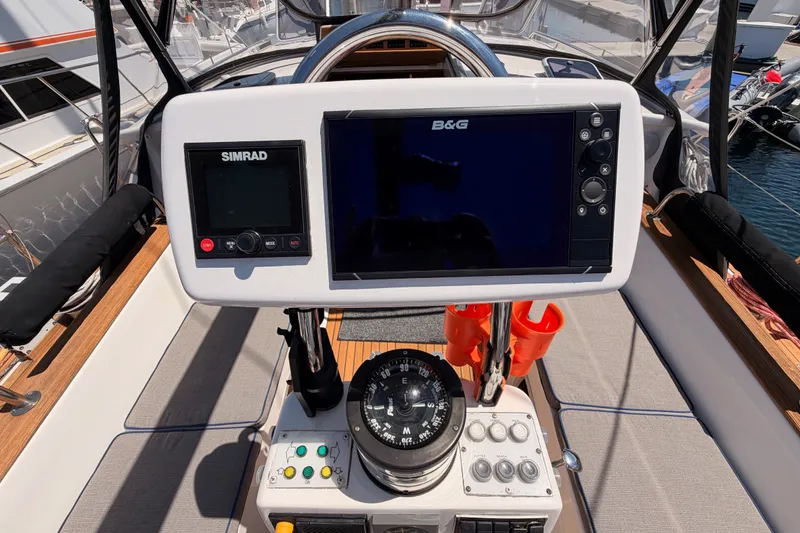 Slide: The Image of Cockpit of 2003 Farr 50 Pilot House with navigation instruments and compass. - 47