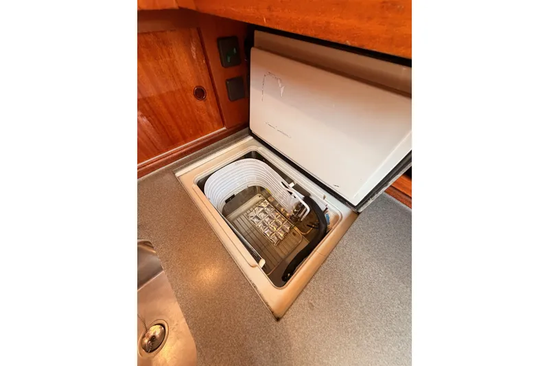 Slide: The Image of Built-in refrigerator in 2003 Farr 50 Pilot House yacht kitchen. - 99