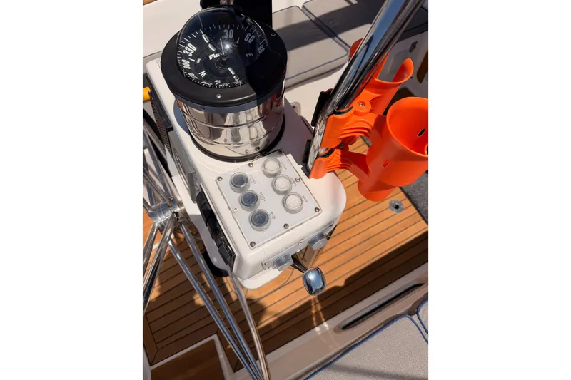 Slide: The Image of Compass and controls on 2003 Farr 50 Pilot House yacht deck. - 49