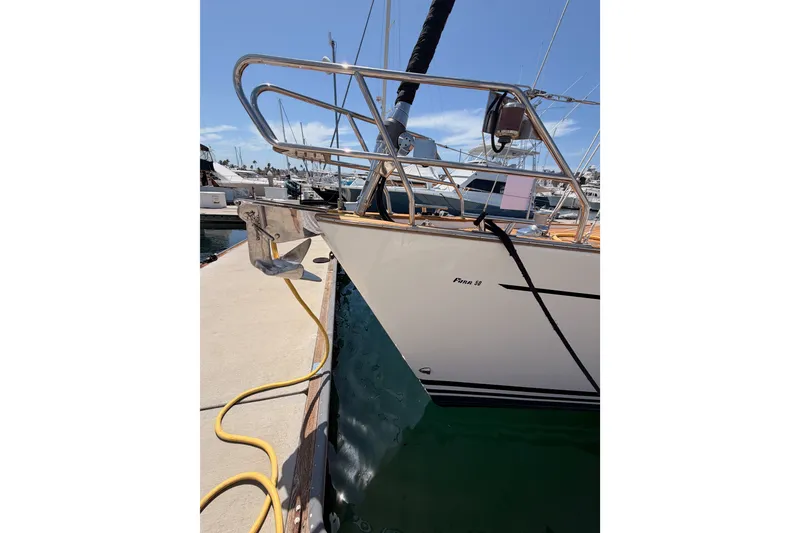 Slide: The Image of 2003 Farr 50 Pilot House yacht docked at marina, sunny day, clear blue sky. - 14