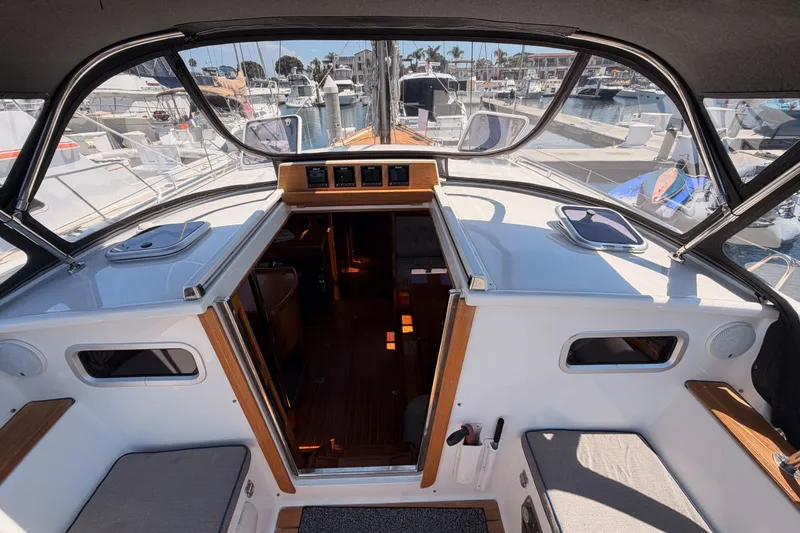 Slide: The Image of Interior view of a 2003 Farr 50 Pilot House yacht docked at a marina. - 52