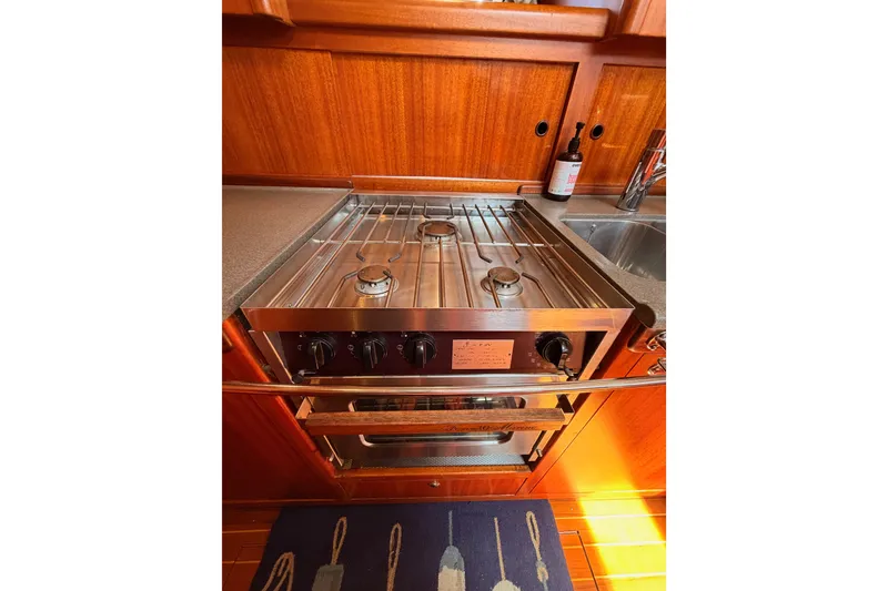 Slide: The Image of Stainless steel stove in 2003 Farr 50 Pilot House yacht kitchen. - 102