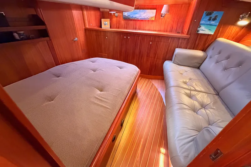 Slide: The Image of Luxurious 2003 Farr 50 Pilot House interior with cozy bed and elegant seating. - 106
