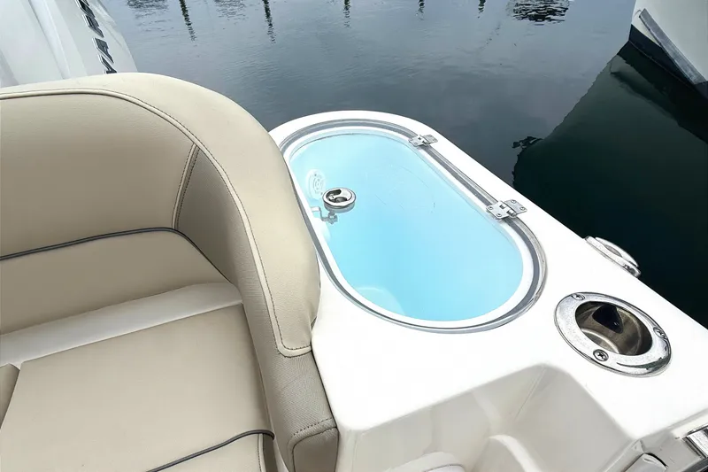 Slide: The Image of 2024 Key West 263 FS boat interior with seating and livewell. - 20