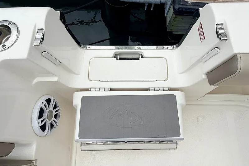 Slide: The Image of 2024 Key West 263 FS boat interior with seating and speaker detail. - 29