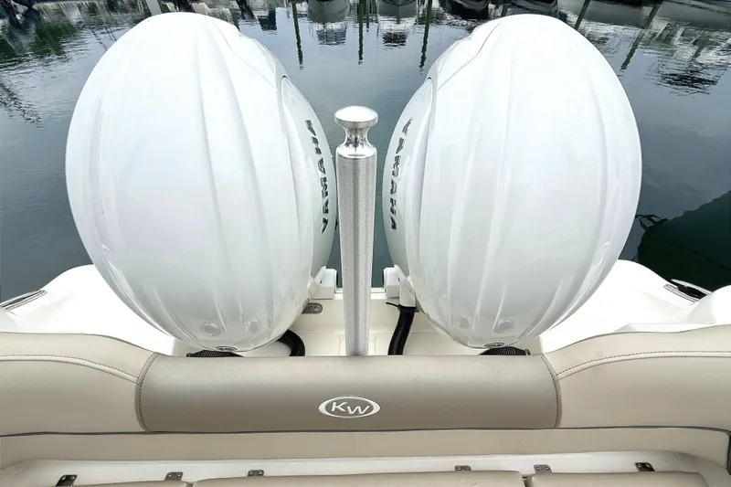Slide: The Image of 2024 Key West 263 FS boat with dual Yamaha outboard engines at dock. - 21