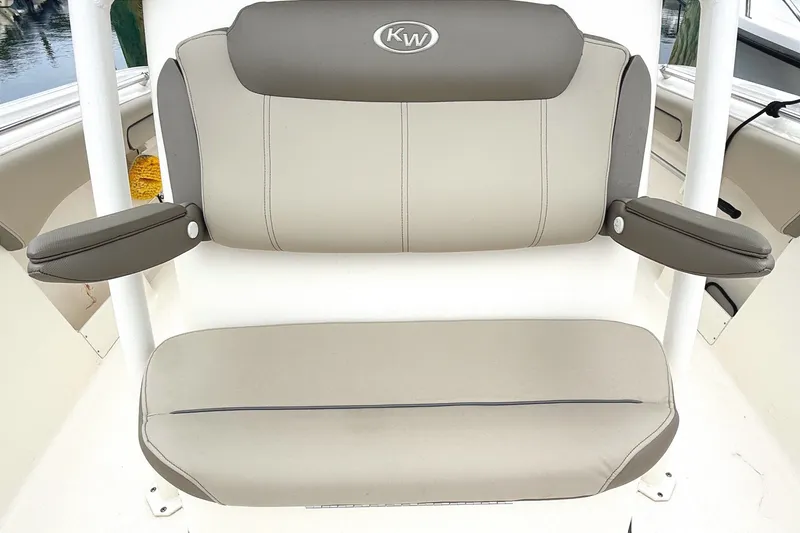 Slide: The Image of 2024 Key West 263 FS boat seat with armrests, featuring gray upholstery. - 24