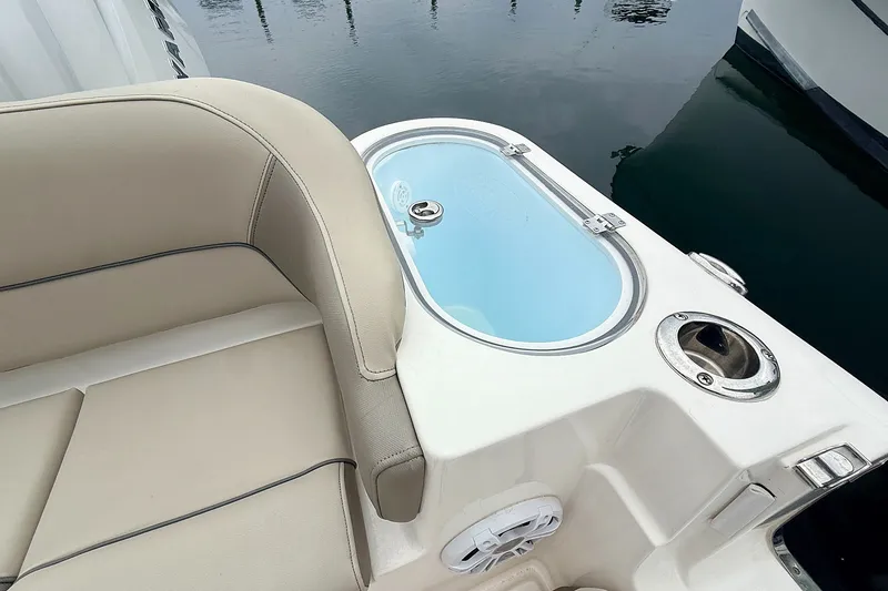 Slide: The Image of 2024 Key West 263 FS boat interior with seating and livewell. - 16