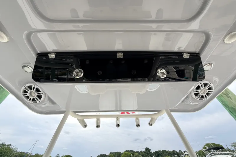 Slide: The Image of 2024 Key West 263 FS boat roof with speakers and storage compartment. - 9