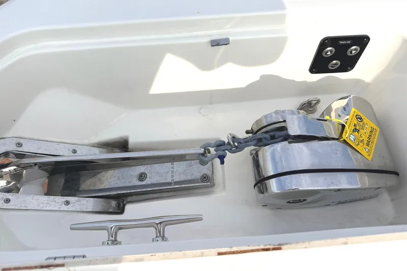 Slide: The Image of 2024 Key West 263 FS boat anchor system with chain and winch in compartment. - 35