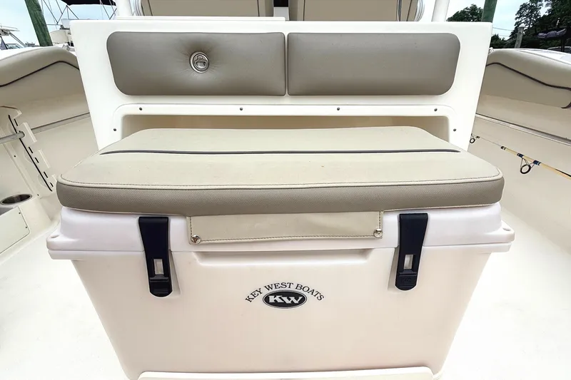 Slide: The Image of 2024 Key West 263 FS boat seat with integrated cooler and cushion. - 17