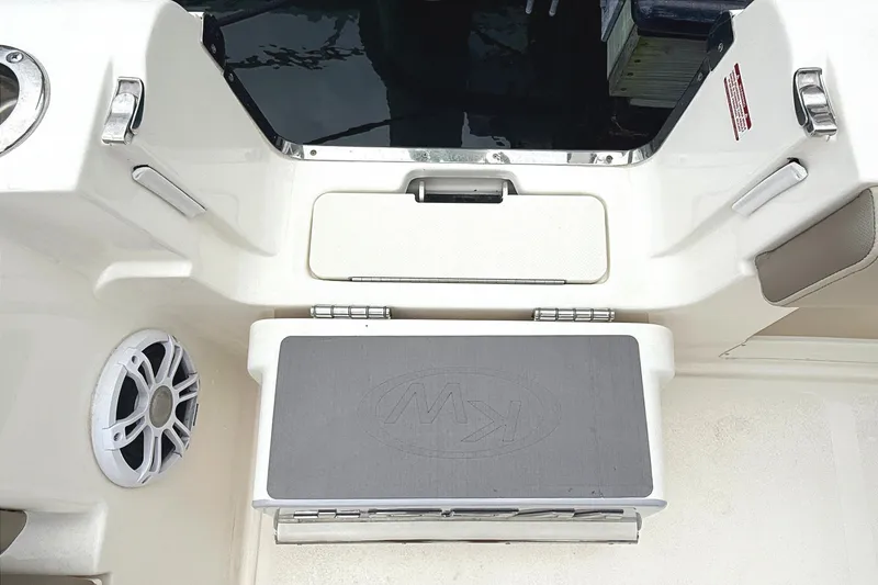 Slide: The Image of 2024 Key West 263 FS boat interior with seating and speaker detail. - 28