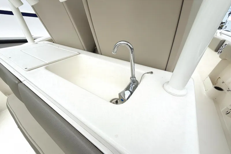 Slide: The Image of 2024 Key West 263 FS boat sink with faucet, featuring sleek design and functionality. - 18