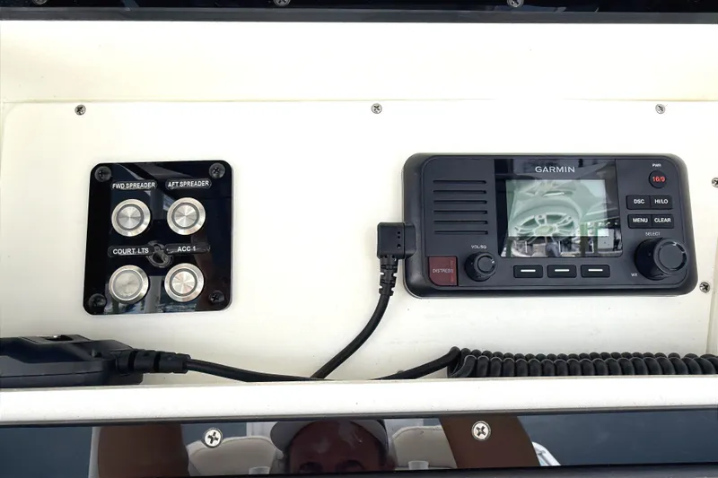 Slide: The Image of 2024 Key West 263 FS boat dashboard with Garmin navigation system and control panel. - 10
