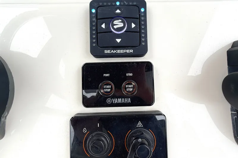 Slide: The Image of Control panel of 2024 Key West 263 FS boat featuring Seakeeper and Yamaha systems. - 8