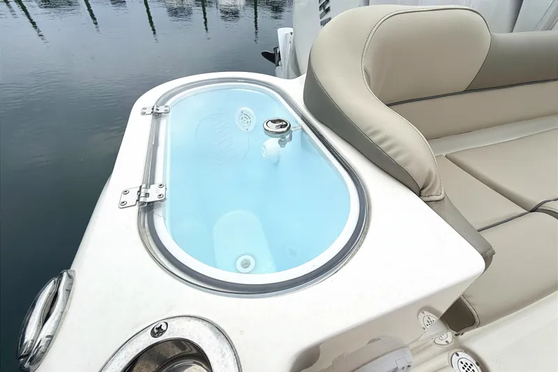 Slide: The Image of 2024 Key West 263 FS boat with livewell and cushioned seating. - 19