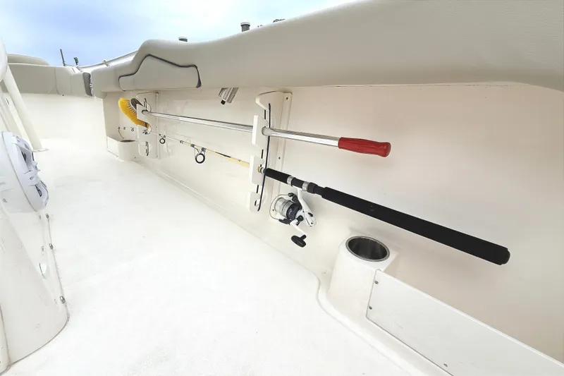 Slide: The Image of 2024 Key West 263 FS boat interior with fishing rod holders and storage features. - 33