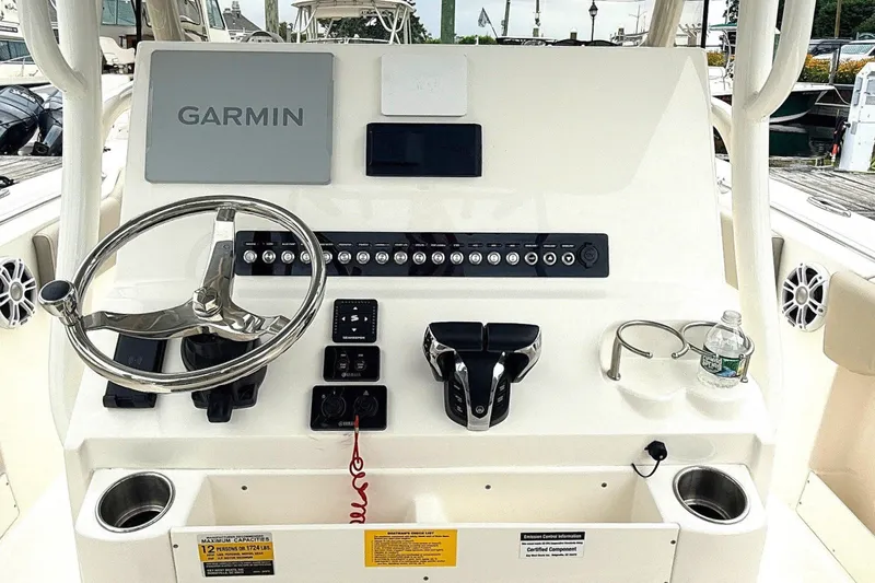 Slide: The Image of 2024 Key West 263 FS boat dashboard with Garmin navigation system at marina. - 6
