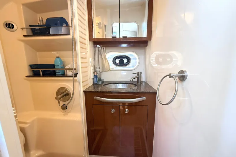 Slide: The Image of Bathroom interior of 2013 Sea Ray Sundancer 370 yacht, featuring sink and shower amenities. - 39