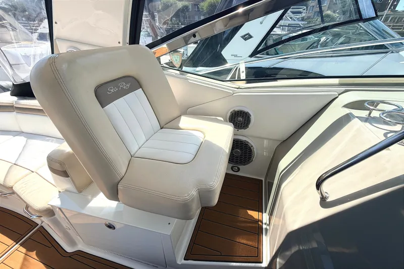Slide: The Image of 2013 Sea Ray Sundancer 370 cockpit with luxurious seating and modern design elements. - 11