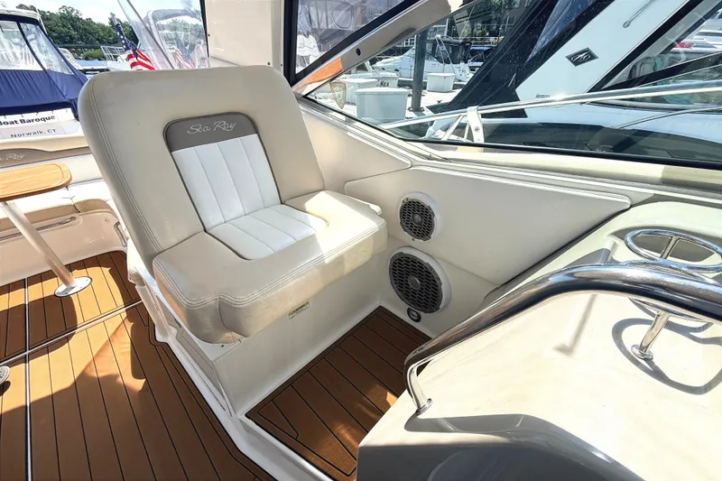 Slide: The Image of Interior of 2013 Sea Ray Sundancer 370 boat with cushioned seating and wooden flooring. - 12