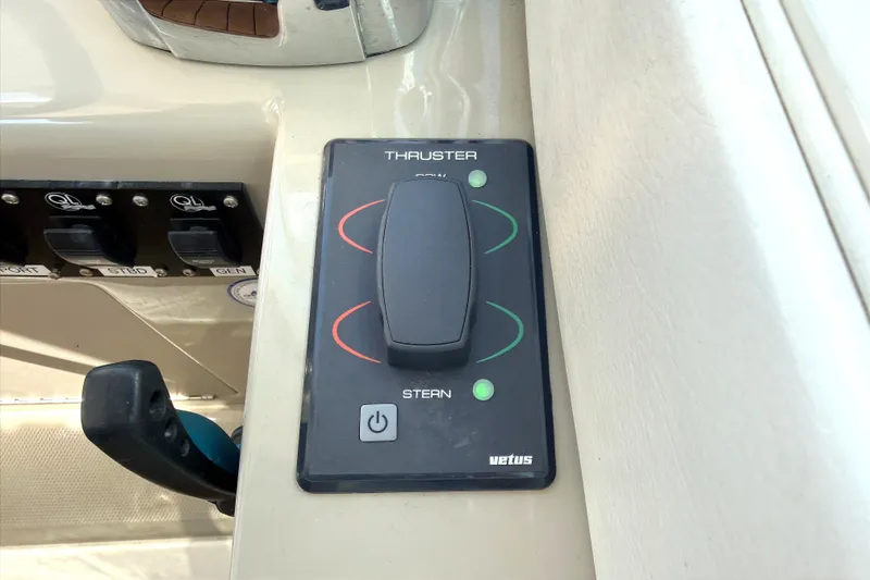 Slide: The Image of Control panel of a 2013 Sea Ray Sundancer 370 boat with thruster controls. - 16