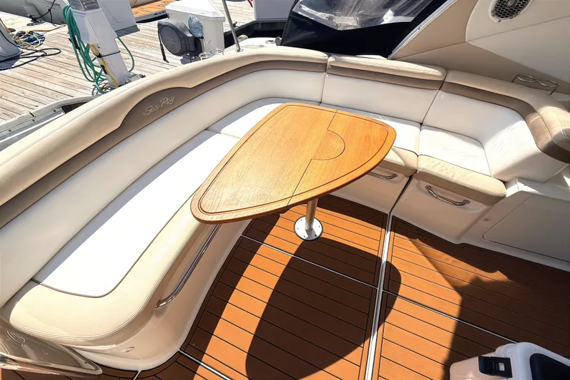 Slide: The Image of Luxurious seating area on a 2013 Sea Ray Sundancer 370 yacht with wooden table. - 6