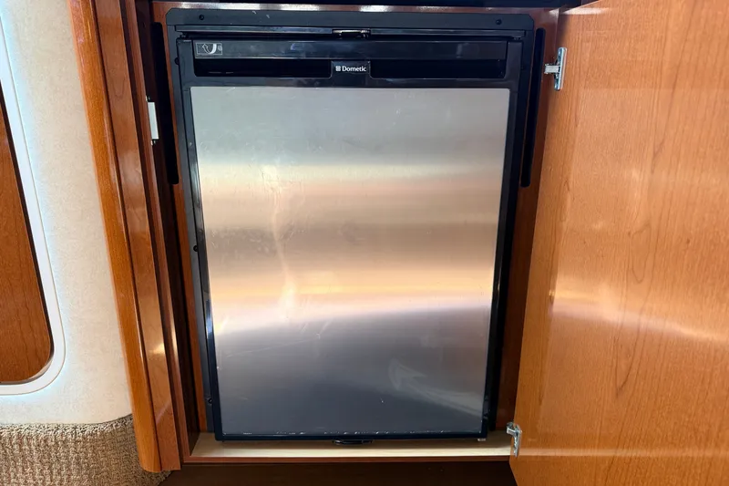 Slide: The Image of Built-in Dometic fridge in 2013 Sea Ray Sundancer 370 yacht interior. - 33