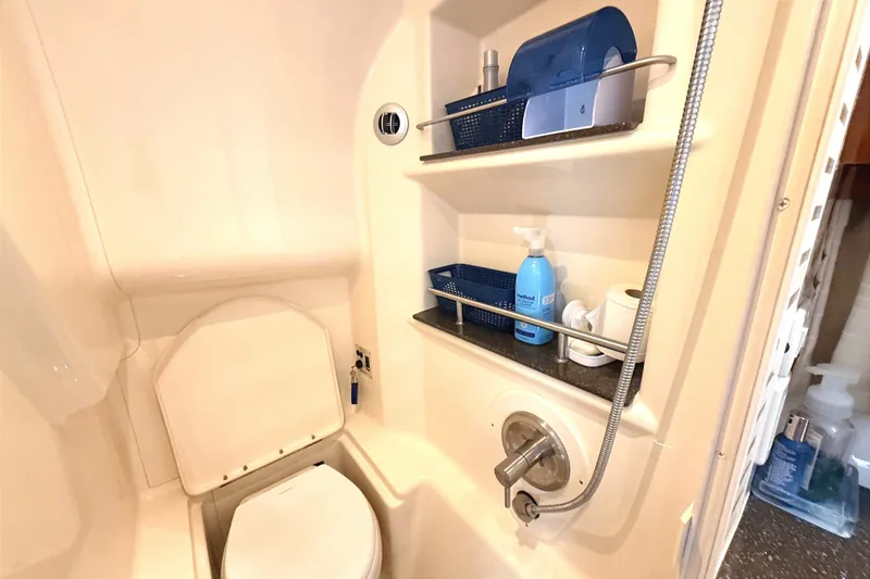 Slide: The Image of Bathroom interior of 2013 Sea Ray Sundancer 370 yacht with shelves and toilet. - 37
