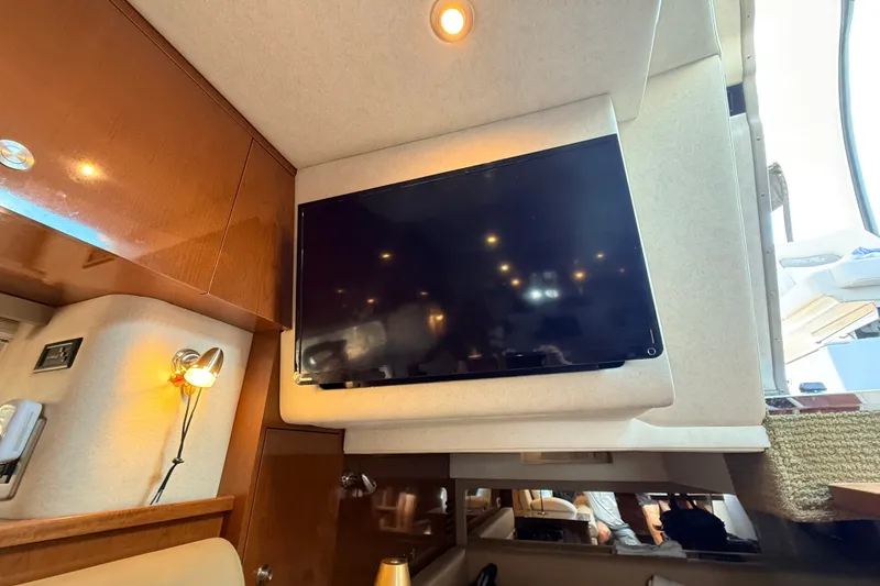 Slide: The Image of Interior of 2013 Sea Ray Sundancer 370 with mounted TV and ambient lighting. - 26