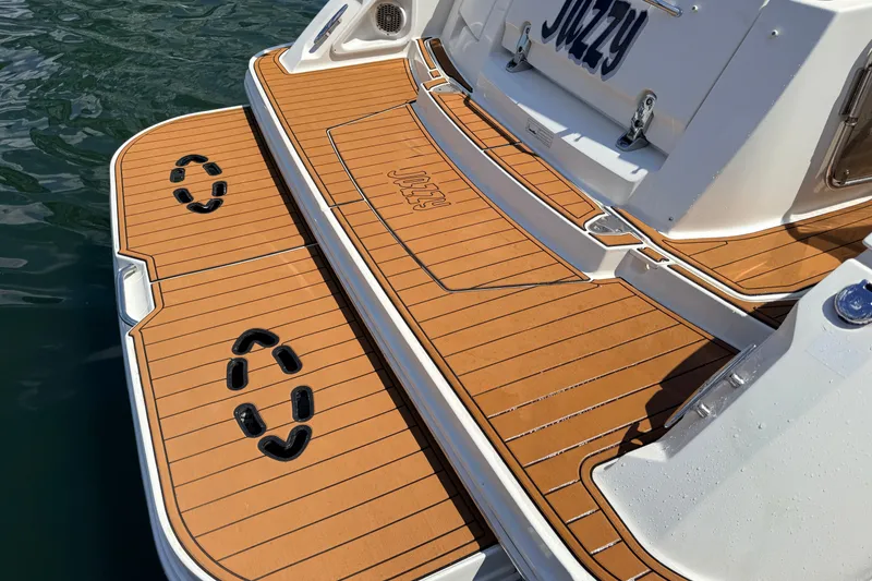 Slide: The Image of 2013 Sea Ray Sundancer 370 swim platform with teak decking and custom nameplate. - 4