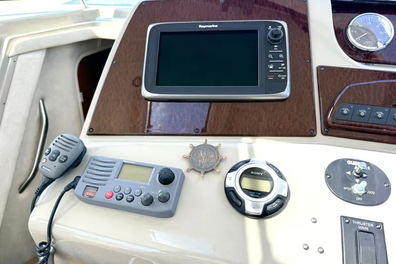 Slide: The Image of 2013 Sea Ray Sundancer 370 helm with navigation and communication equipment. - 14