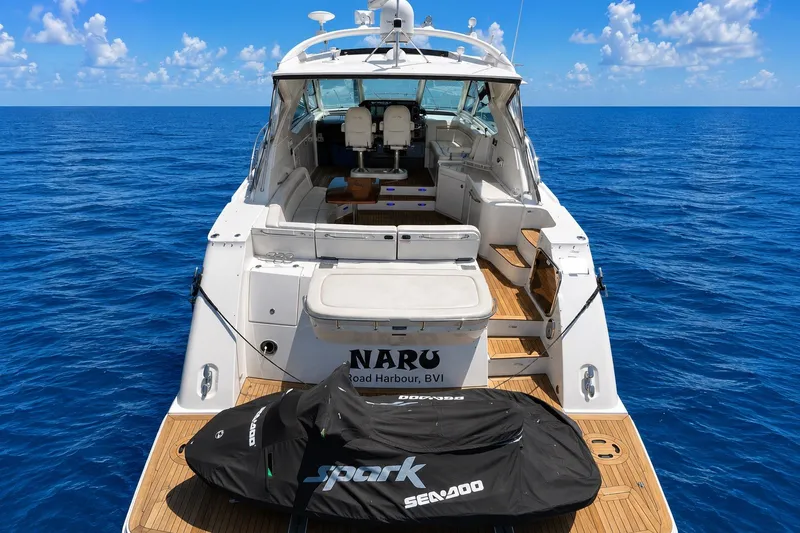 Slide: The Image of 2010 Sea Ray Sundancer 540 yacht on open ocean with Sea-Doo jet ski. - 5