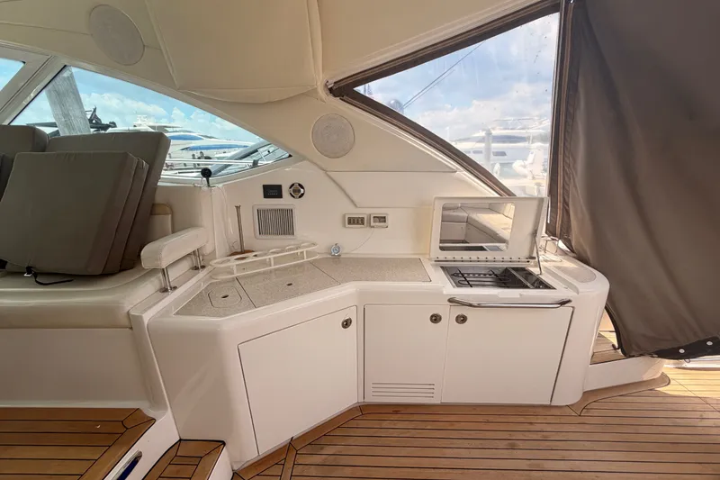 Slide: The Image of Luxurious 2010 Sea Ray Sundancer 540 yacht interior with kitchenette and seating area. - 24