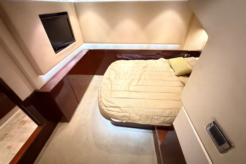 Slide: The Image of Luxurious cabin interior of 2010 Sea Ray Sundancer 540 yacht with cozy bed and TV. - 12
