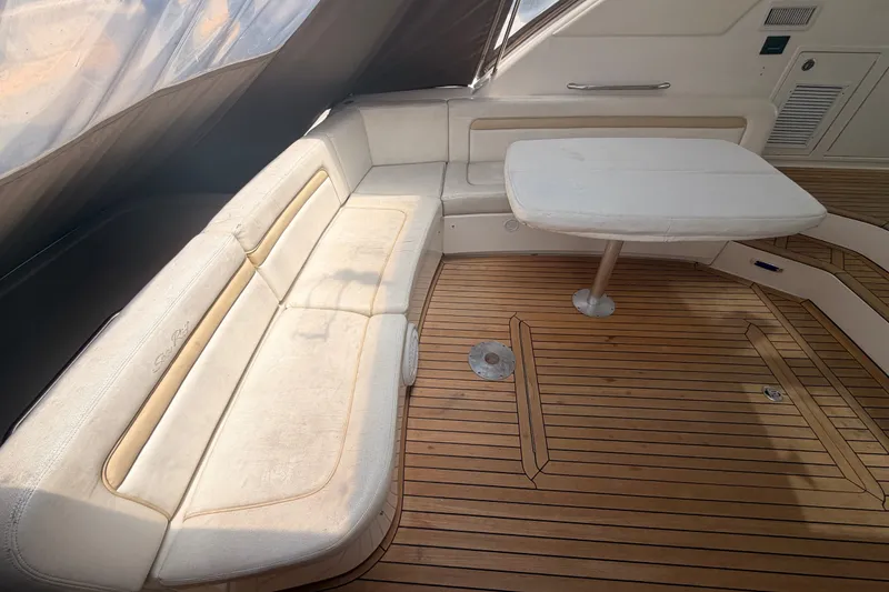 Slide: The Image of Luxurious seating area on 2010 Sea Ray Sundancer 540 yacht with wooden flooring. - 7