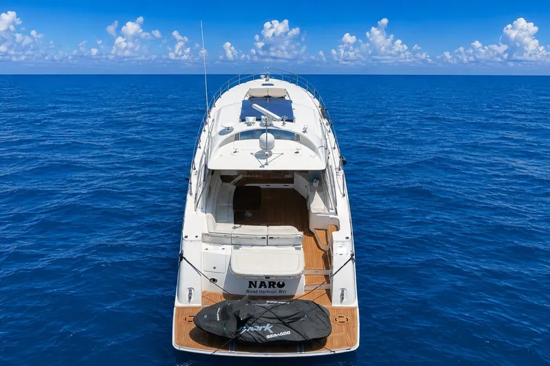 Slide: The Image of Sea Ray Sundancer 540 yacht cruising on open ocean, 2010 model, under clear blue sky. - 6