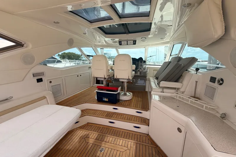 Slide: The Image of Luxurious interior of 2010 Sea Ray Sundancer 540 yacht with elegant seating and wood flooring. - 26