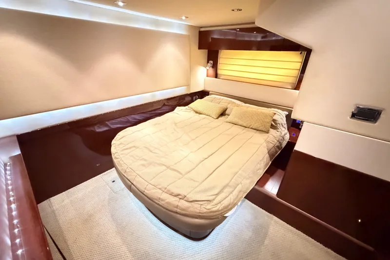 Slide: The Image of Luxurious bedroom interior of 2010 Sea Ray Sundancer 540 yacht with cozy bedding. - 11