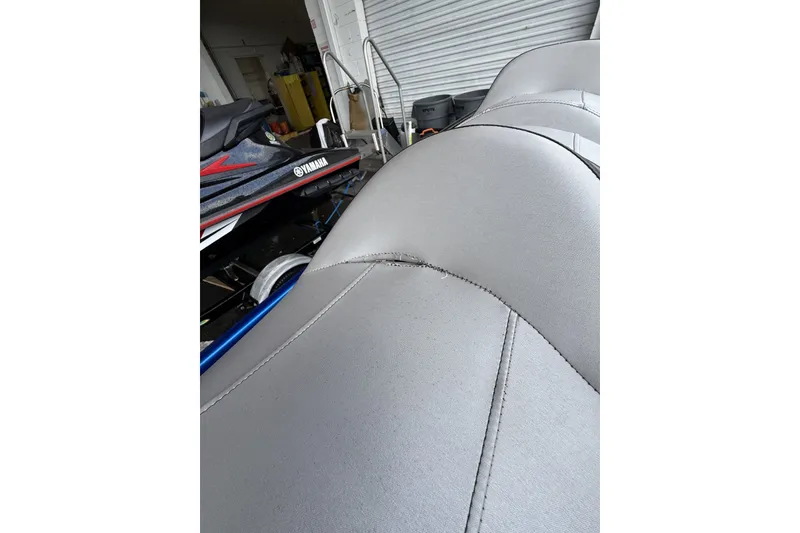 Slide: The Image of 2017 Yamaha WaveRunner VX Limited HO with sleek gray seating in a garage setting. - 12