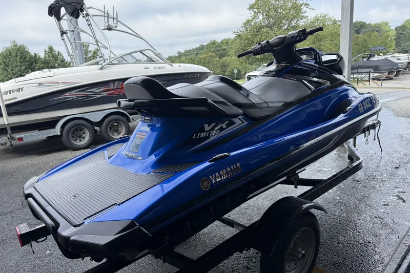 Slide: The Image of 2017 Yamaha WaveRunner VX Limited HO on trailer, parked near other boats. - 4