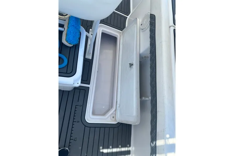 Slide: The Image of Open storage compartment on 2007 Donzi 35 ZF Cuddy boat deck. - 17