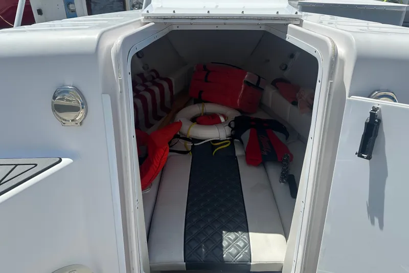 Slide: The Image of 2007 Donzi 35 ZF Cuddy cabin interior with life jackets and safety equipment. - 13