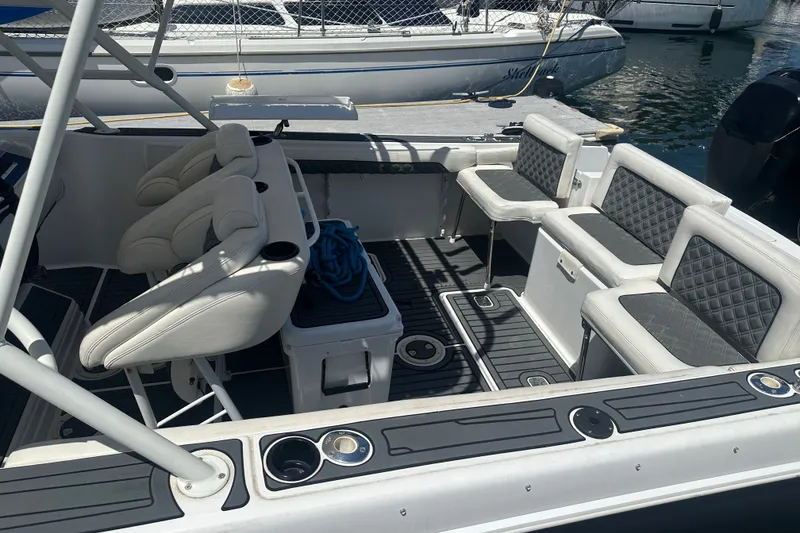 Slide: The Image of 2007 Donzi 35 ZF Cuddy boat interior with seating and cup holders. - 11