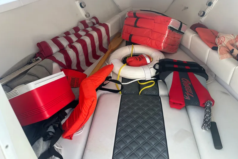 Slide: The Image of Interior of a 2007 Donzi 35 ZF Cuddy with life jackets and boating gear. - 15