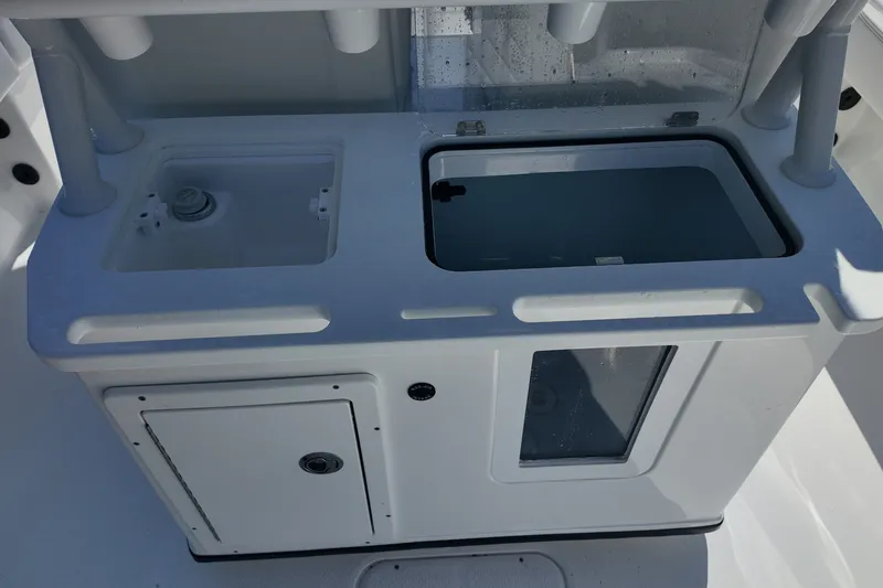 Slide: The Image of 2027 Blazer Bay Makaira 2800 boat console with storage and sink. - 19