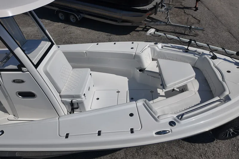 Slide: The Image of 2027 Blazer Bay Makaira 2800 boat interior with seating and storage compartments. - 24