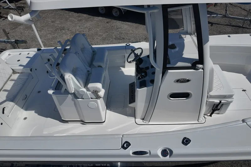 Slide: The Image of 2027 Blazer Bay Makaira 2800 boat interior with seating and steering console. - 23