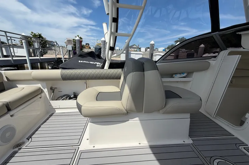 Slide: The Image of 2025 Key West 239 DFS boat interior with cushioned seating and sleek design. - 15