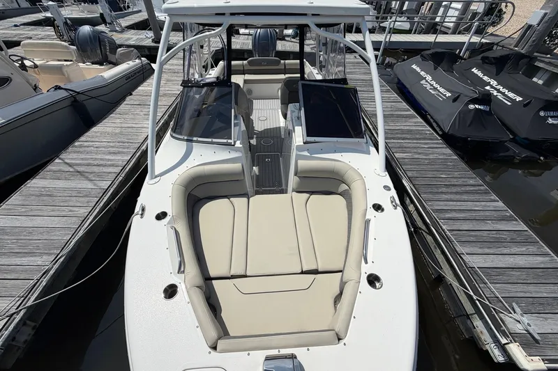 Slide: The Image of 2025 Key West 239 DFS boat docked, featuring spacious seating and sleek design. - 24